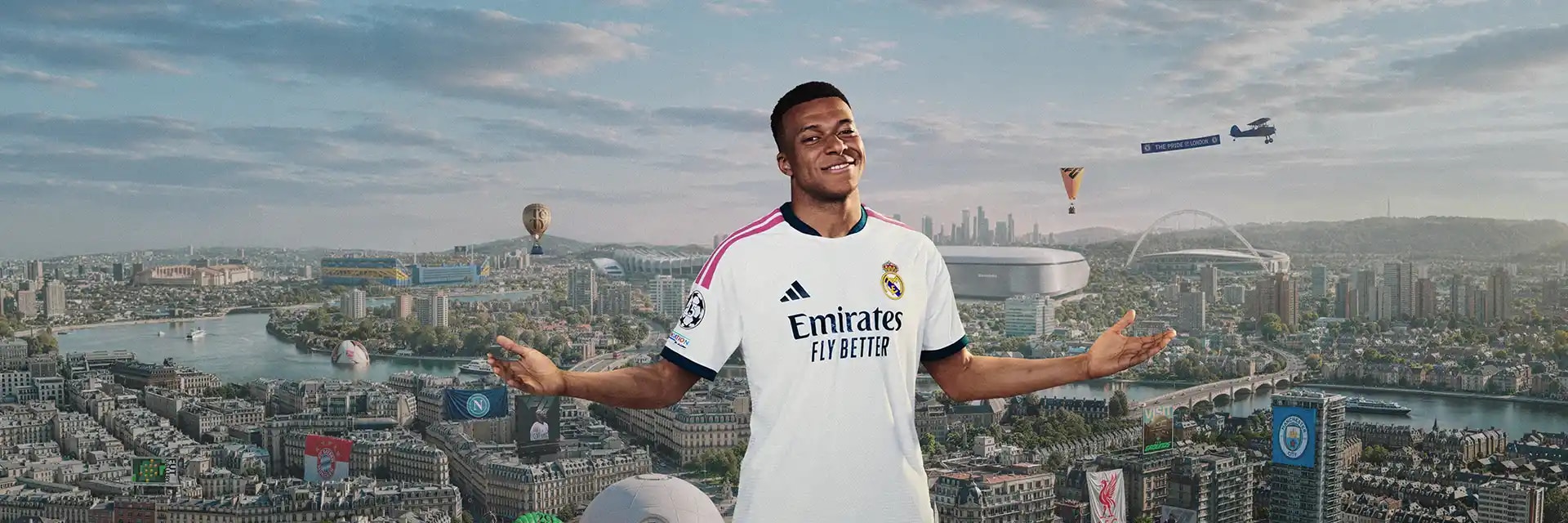 Kylian Mbappé stands with arms outstretched above a city skyline featuring football stadiums and club banners.
