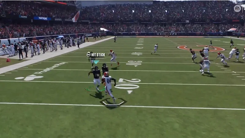 Ball carrier runs downfield as a defender closes in, with the Hit Stick control prompt displayed.