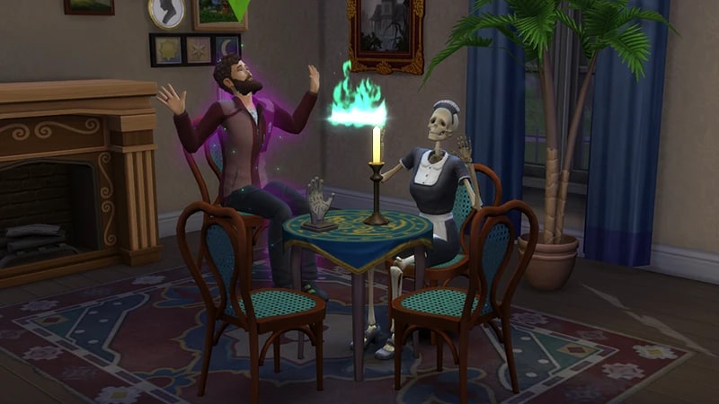 A Sim levitates in his chair at the Séance Table with Broomhilda. A circle of green flames floats above them.