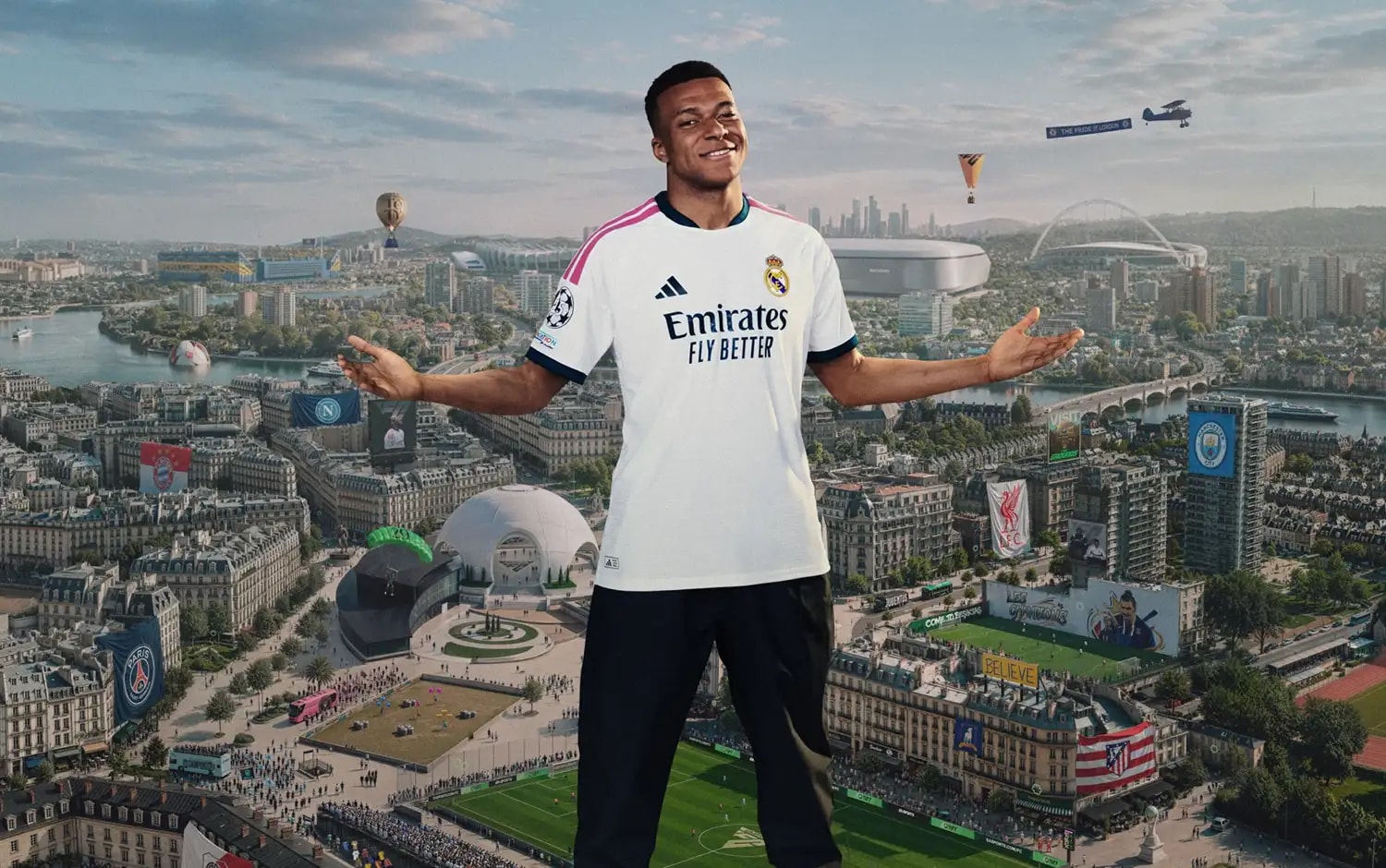 Kylian Mbappé stands with arms outstretched above a city skyline featuring football stadiums and club banners.