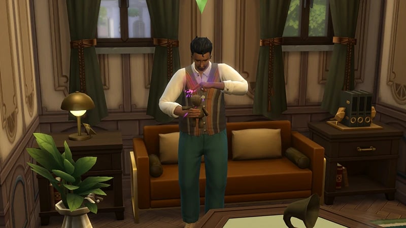 A Sim stands in front of a brown sofa in The Sims 4, he’s holding a voodoo doll with purple sparks around it.