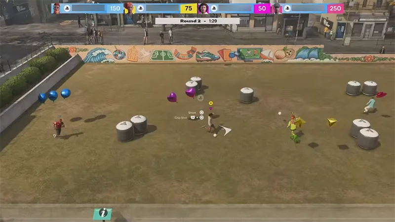 Players compete in Balloon Ball, kicking balls at colored balloons while navigating obstacles on the pitch.