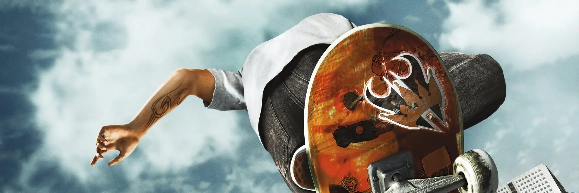  Close-up of a skateboarder performing an aerial trick, with the bottom of the skateboard in the foreground.