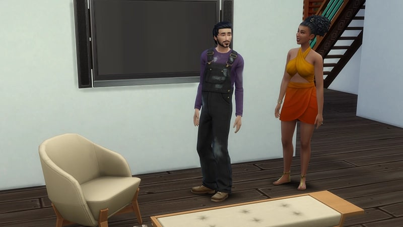 A Sim wearing black, paint-covered overalls, shows off a newly redecorated room to another Sim.